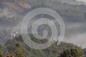 Clouds climbing the mountains at Kausani, India photo